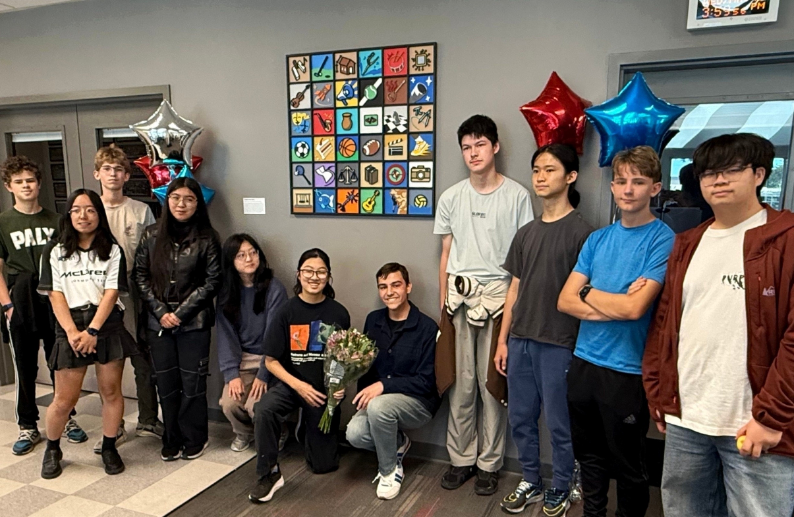 Members of Palo Alto High School Art + Tech and Saratoga High School Art Club gather beside the finished Interwoven installation.